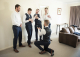 Groom proposing to groomsmen