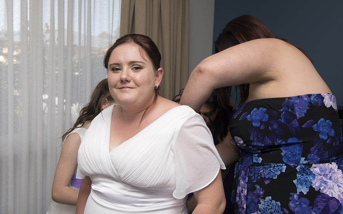 rendezvous experience wedding - eleanor & justin 9 Bride putting on dress