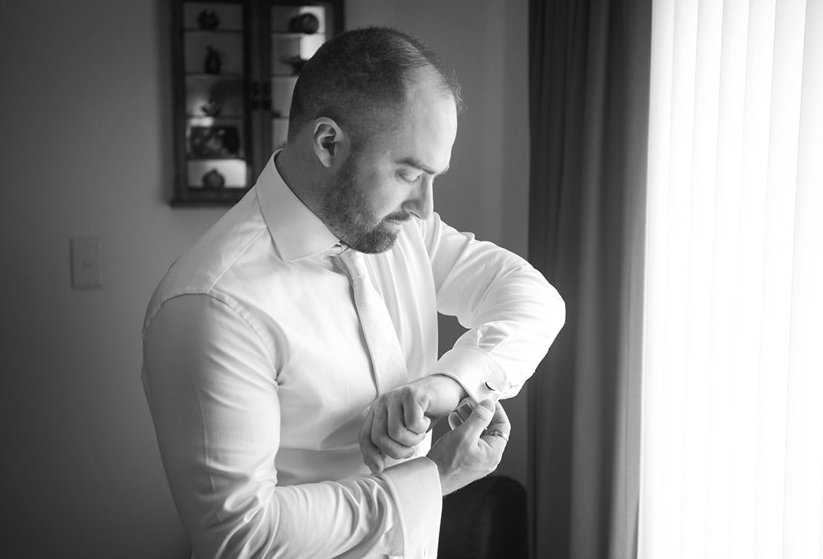pepper tree cafe wedding - amanda & daniel 82 Putting on cufflinks