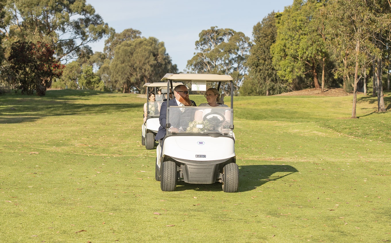 arrive in style: unique wedding transportation ideas 8 Bride and groom in golf cart