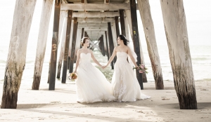 cruising yacht club of sa wedding - emily & angel 1 Walking together under Grange jetty