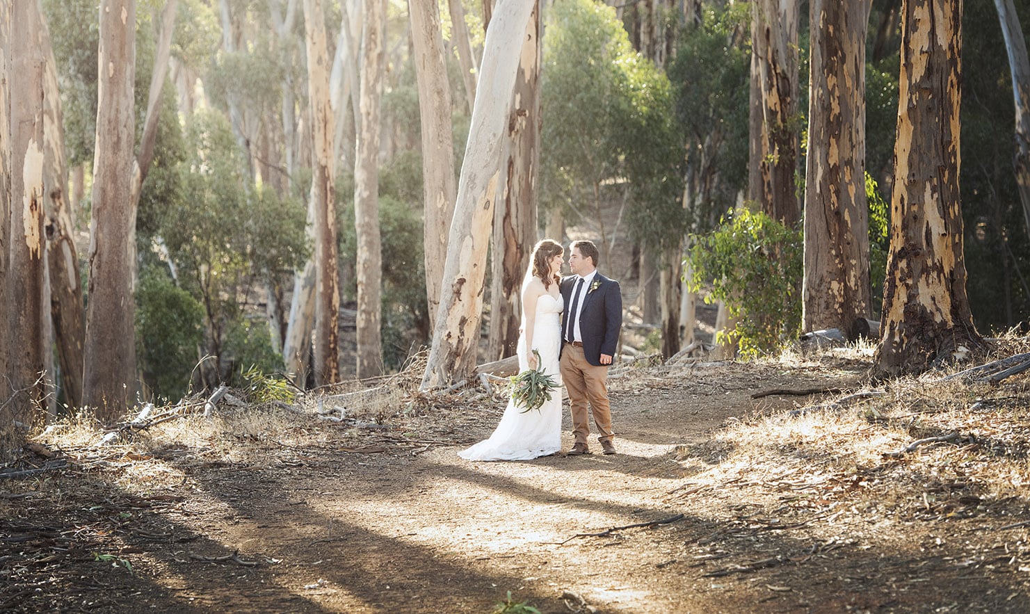 bride and groom standing in the Belair National park