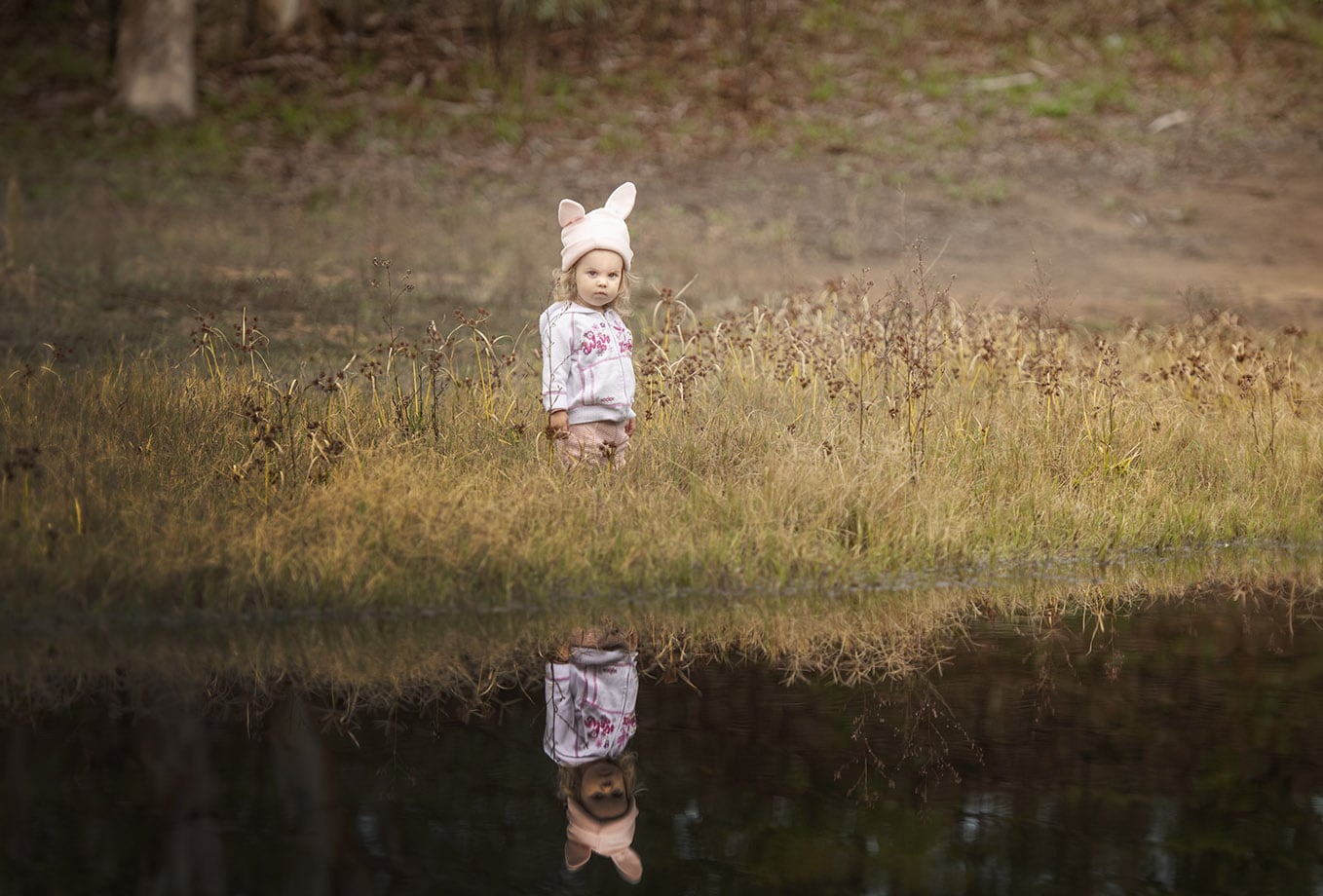 little girl on waters edge Little girl on waters edge