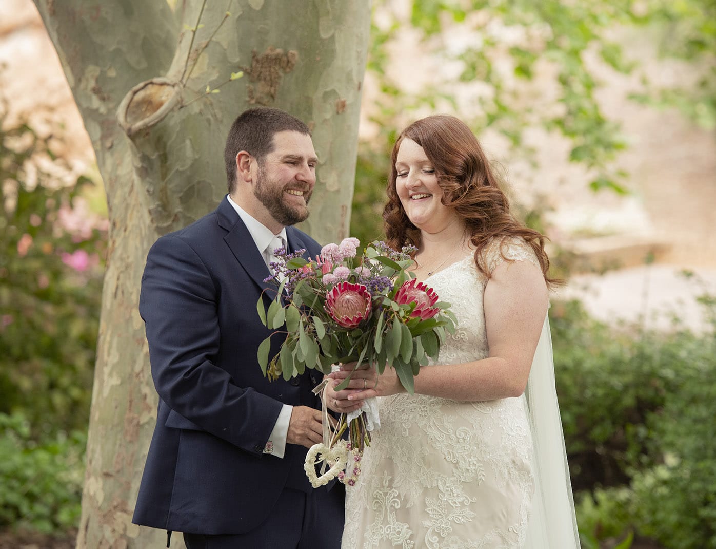 stockade botanic park elopement - sheridyn & chris 2 Bride and groom having fun under a tree