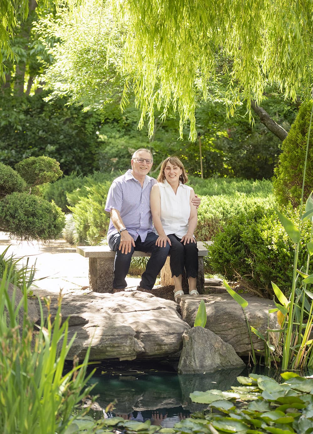 veale & himeji gardens family shoot 20 Sitting on the bench together in Himeji Gardens