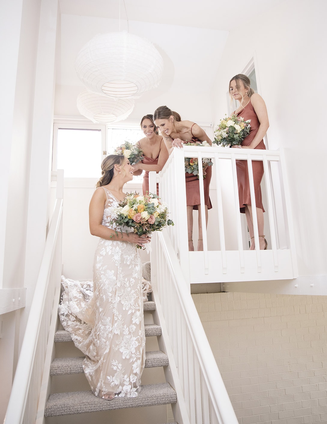 seppeltsfield winery wedding - tahlia & alex 23 Bridal party having fun on white stairs