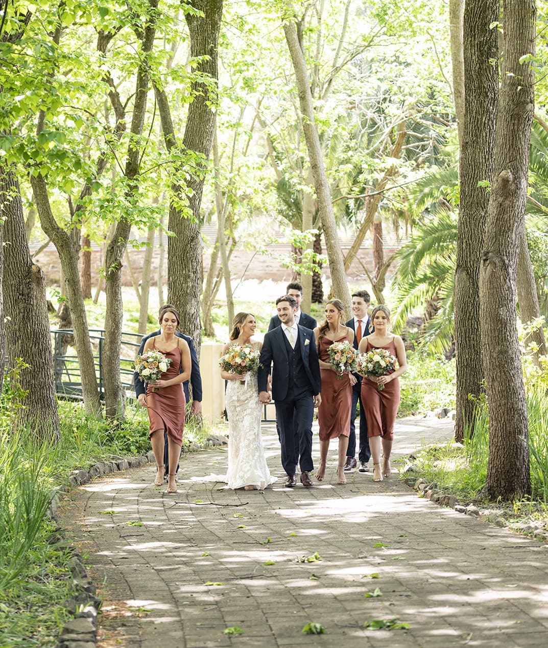 seppeltsfield winery wedding - tahlia & alex 36 Bridal party walking amongst the trees