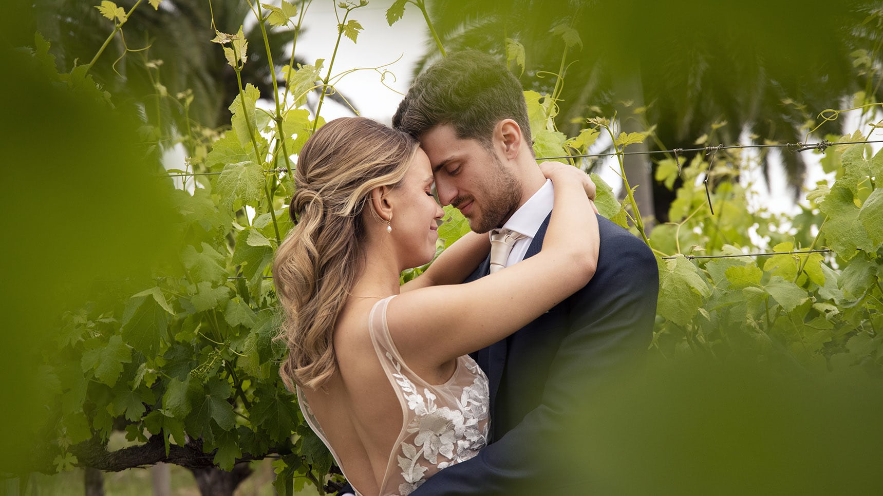 seppeltsfield winery wedding - tahlia & alex 64 Bride and grom holding one another in vineyards 5