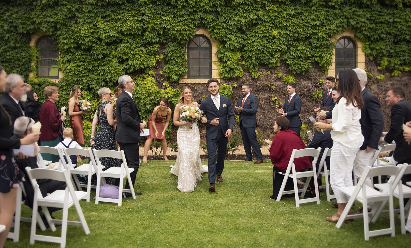 seppeltsfield winery wedding - tahlia & alex 59 Bride and groom exiting wedding cermeony at Seppeltsfield winery
