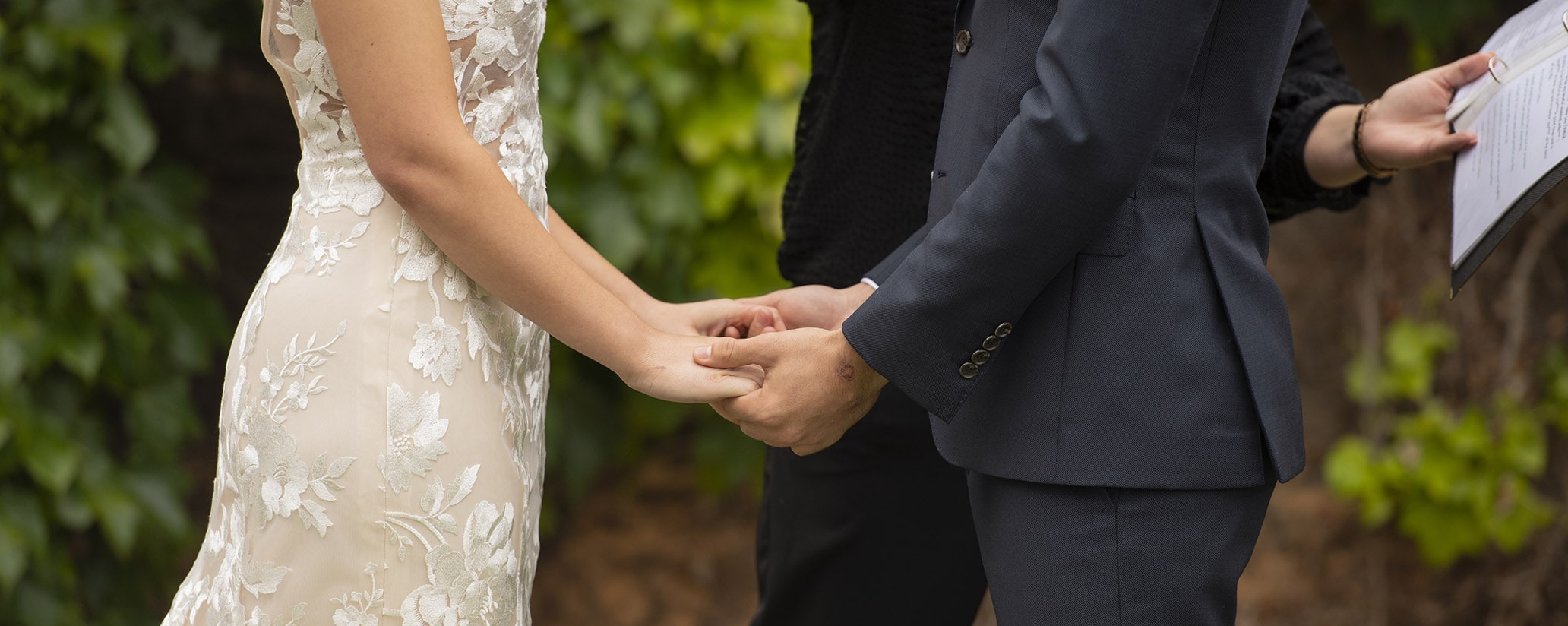 seppeltsfield winery wedding - tahlia & alex 50 Bride and groom holding hands during wedding ceremony