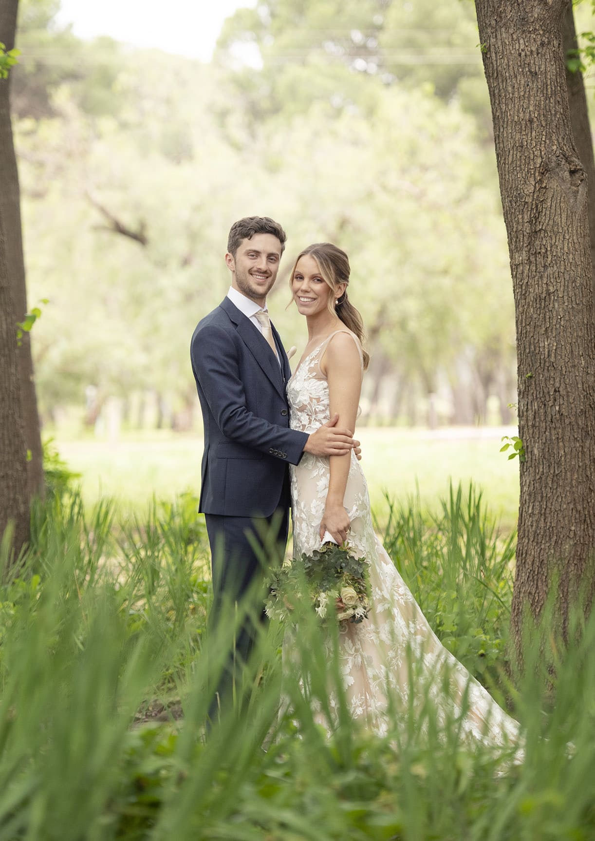 seppeltsfield winery wedding - tahlia & alex 65 Bride and groom standing with each other in trees