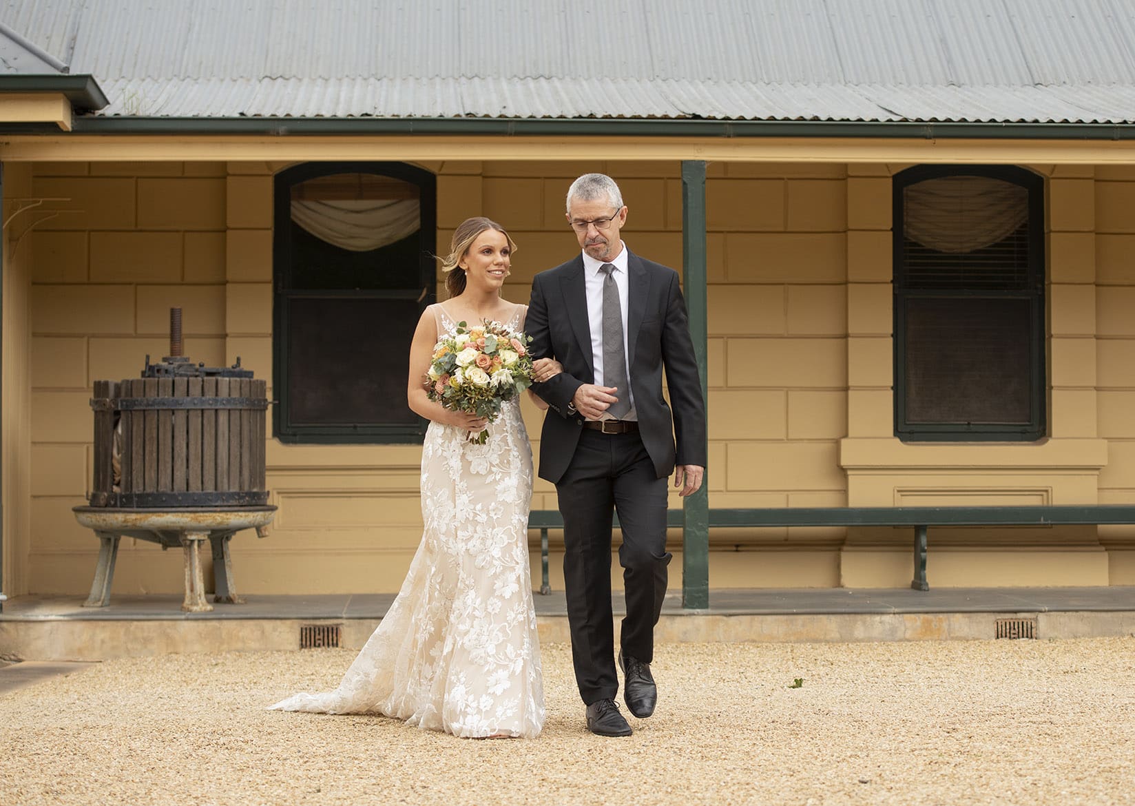 seppeltsfield winery wedding - tahlia & alex 44 bride being walked down aisle with father