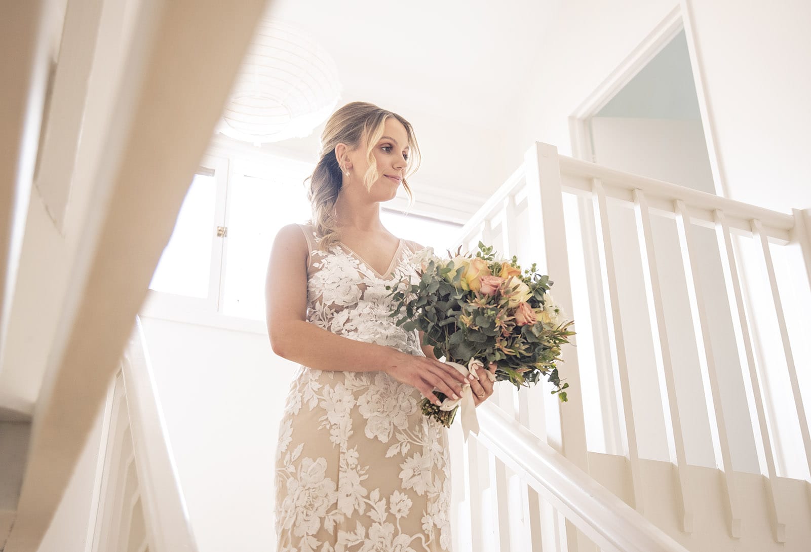 seppeltsfield winery wedding - tahlia & alex 24 Bride playing with her bouquet on stairs