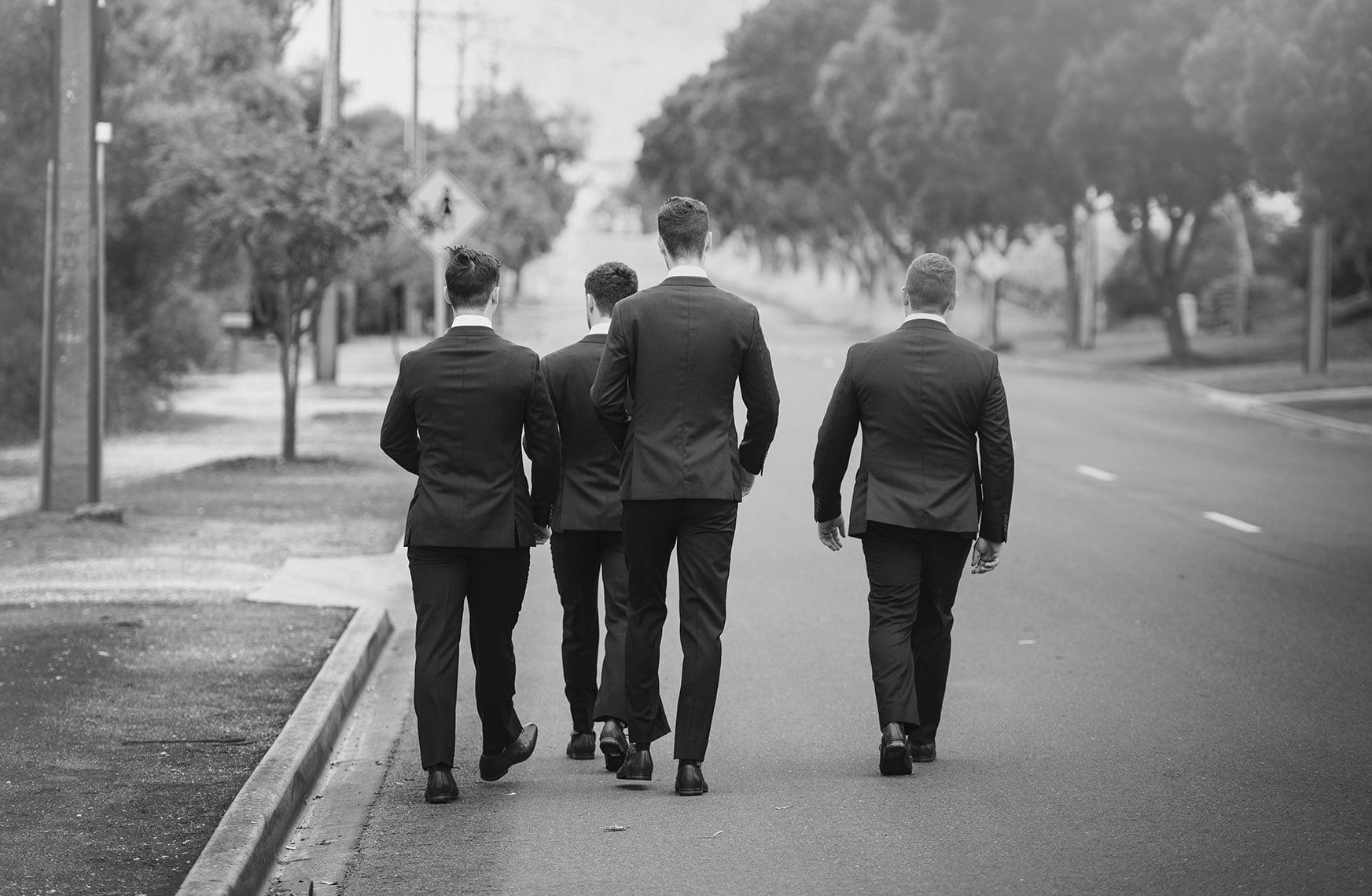 seppeltsfield winery wedding - tahlia & alex 10 Groom and grooms men walking away down road