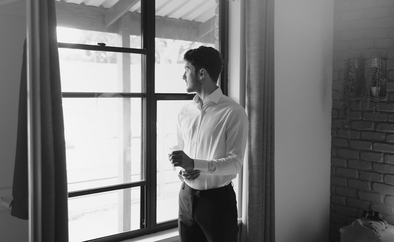 seppeltsfield winery wedding - tahlia & alex 5 Groom looking out window pensively