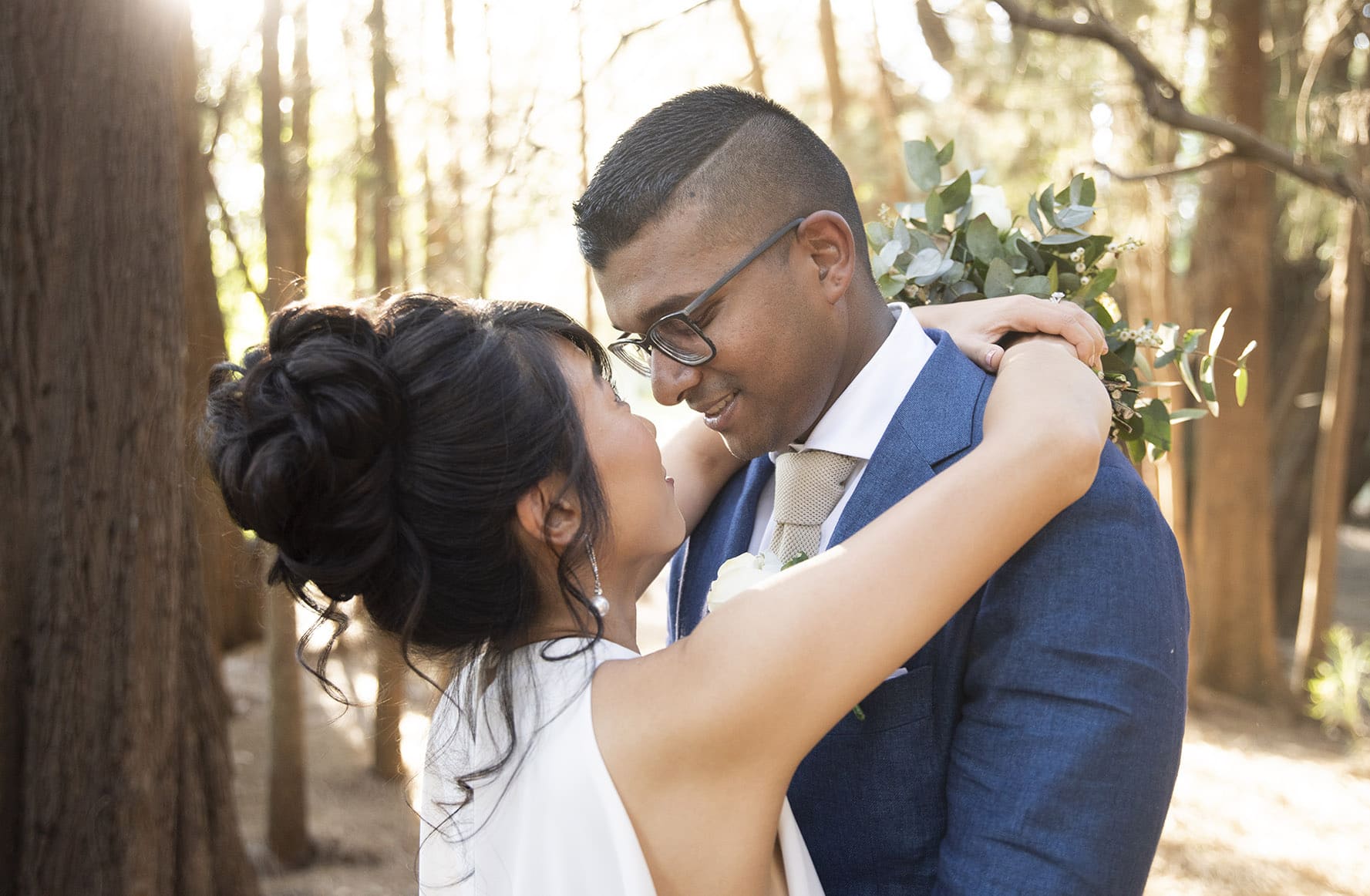 Bride and groom embrace