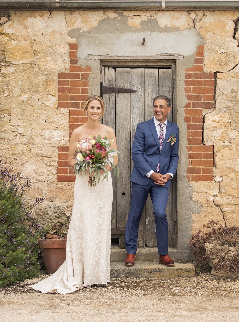 crabtree farm wedding - sarah & elten 35 Bride and groom in doorway at Crabtree farm