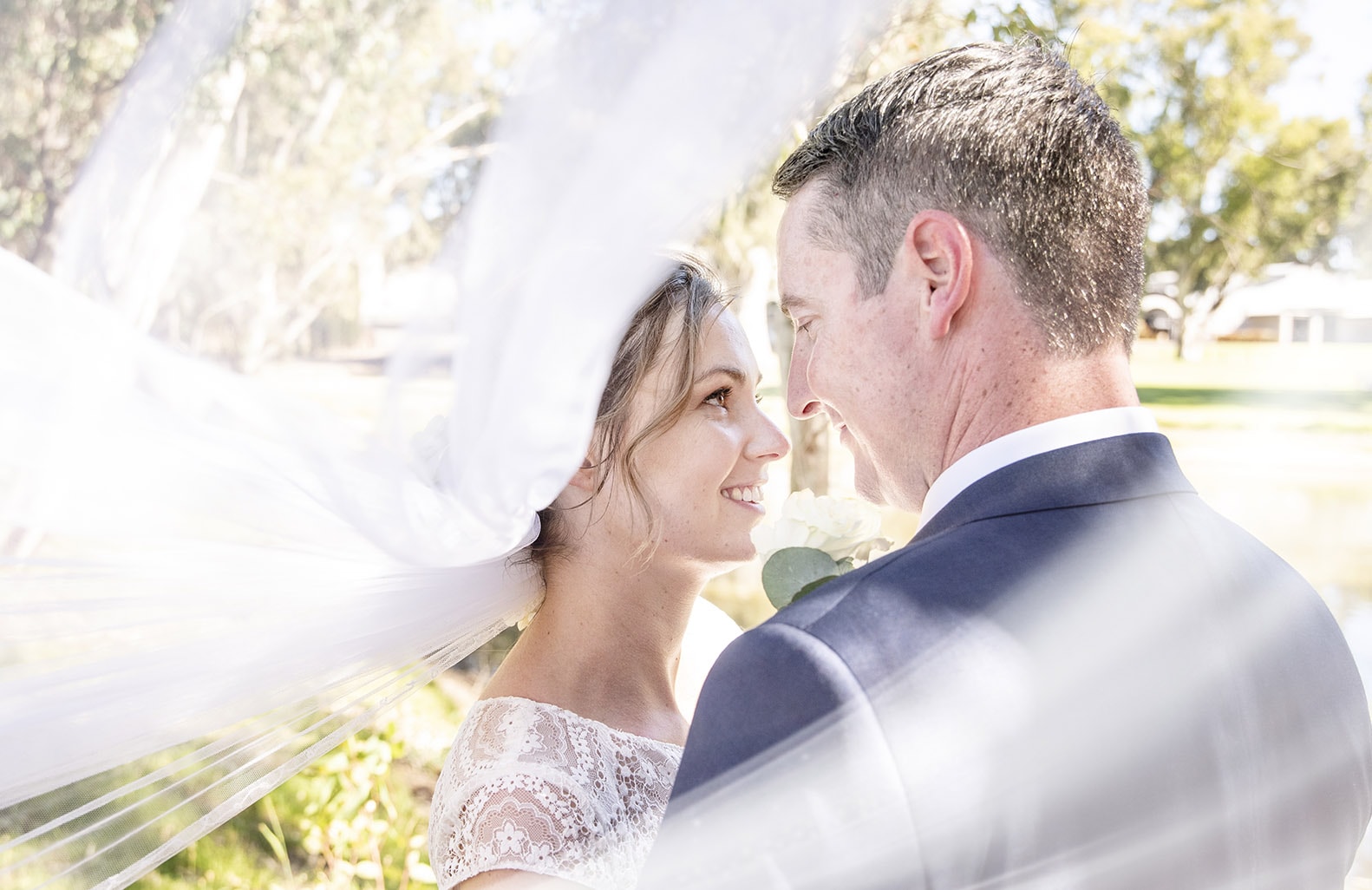 serafino wines wedding - claire & arron 52 Bride and groom surrounded by the veil