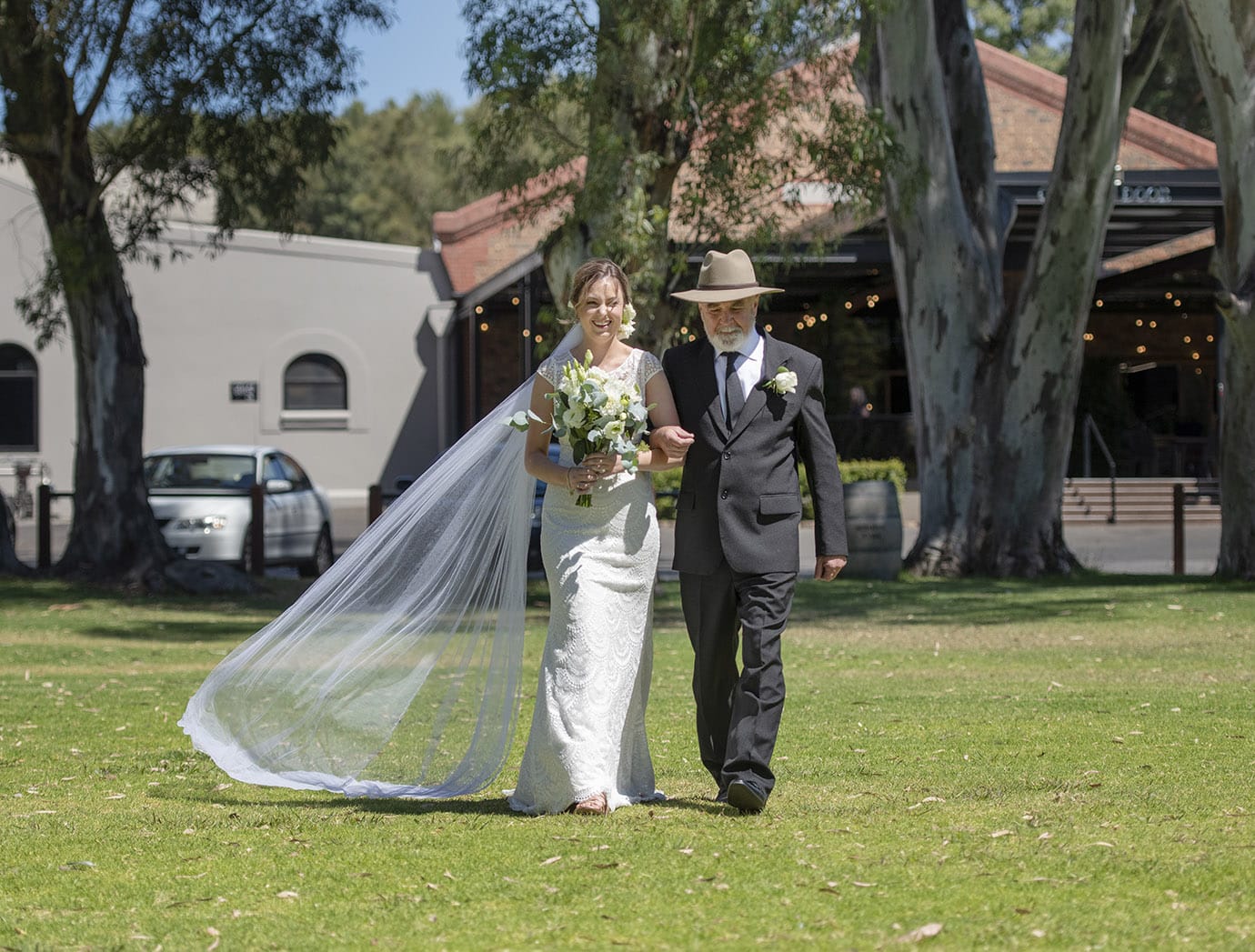 serafino wines wedding - claire & arron 36 bride being walked to ceremony by her father