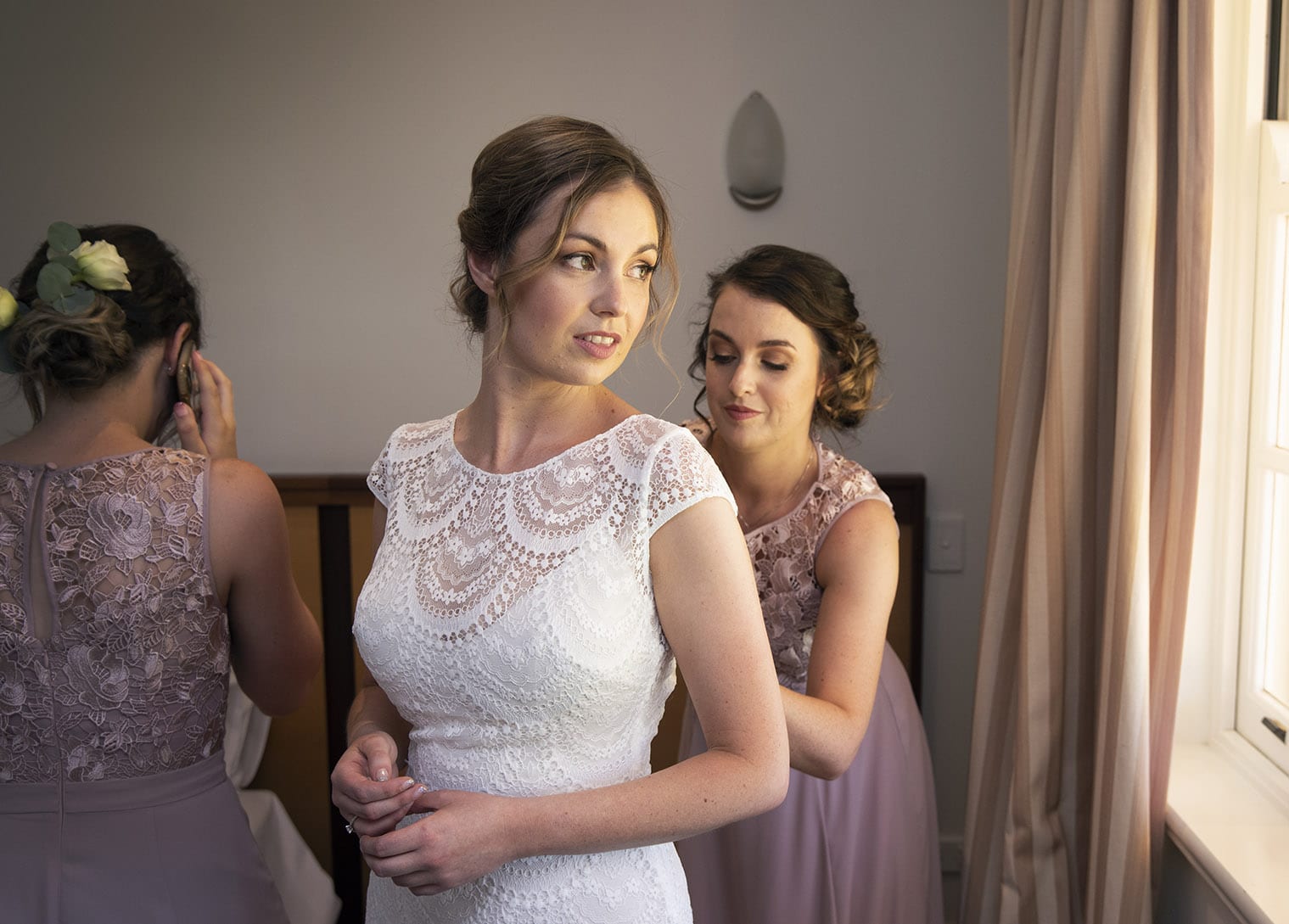 important wedding photography dos and don'ts 3 bride looking out window as she gets ready