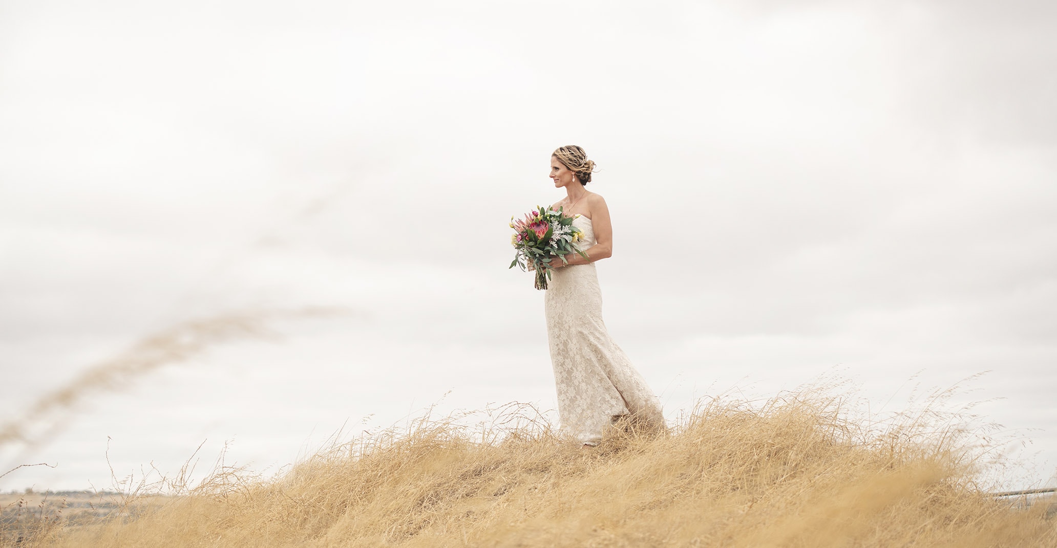 crabtree farm wedding - sarah & elten 31 Bride on a grassy hill