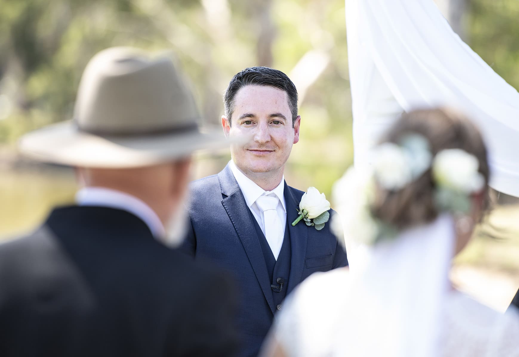 serafino wines wedding - claire & arron 37 Grooms first look of bride through fathers brim