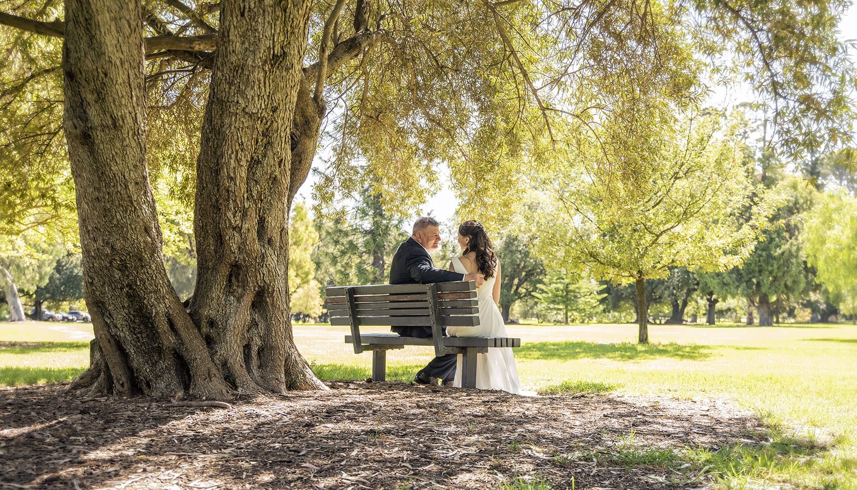 botanic park wedding - naz & peter 21 bride and groom sitting on a bench together