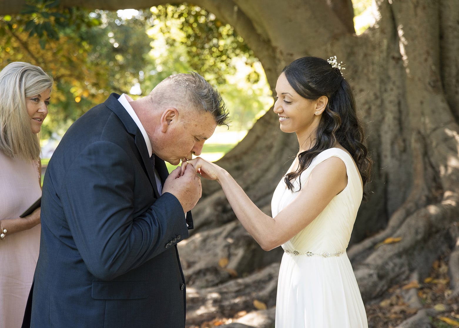 botanic park wedding - naz & peter 19 Groom kissing hand of his bride