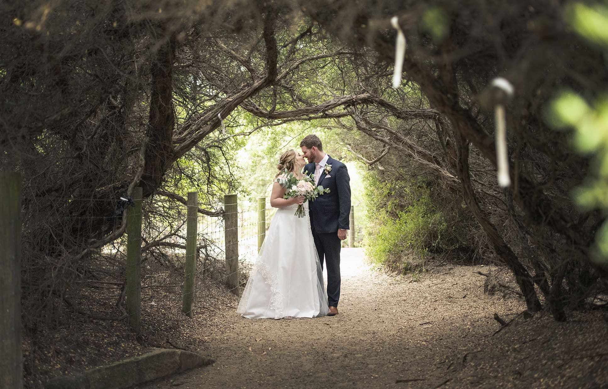 seagrass long point wedding - hobart - georgia & matt 71 Bride and groom in foliage tunnel near Seagrass Long Point