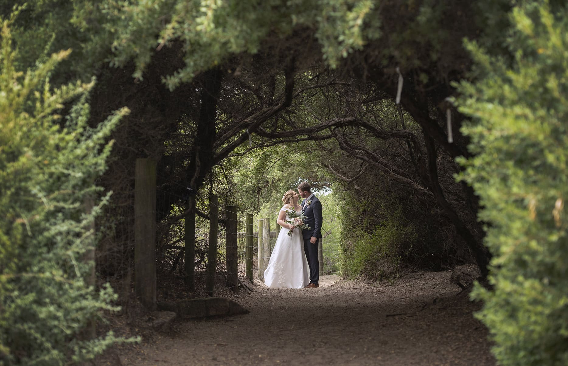 seagrass long point wedding - hobart - georgia & matt 70 Bride and groom in foliage tunnel near Seagrass