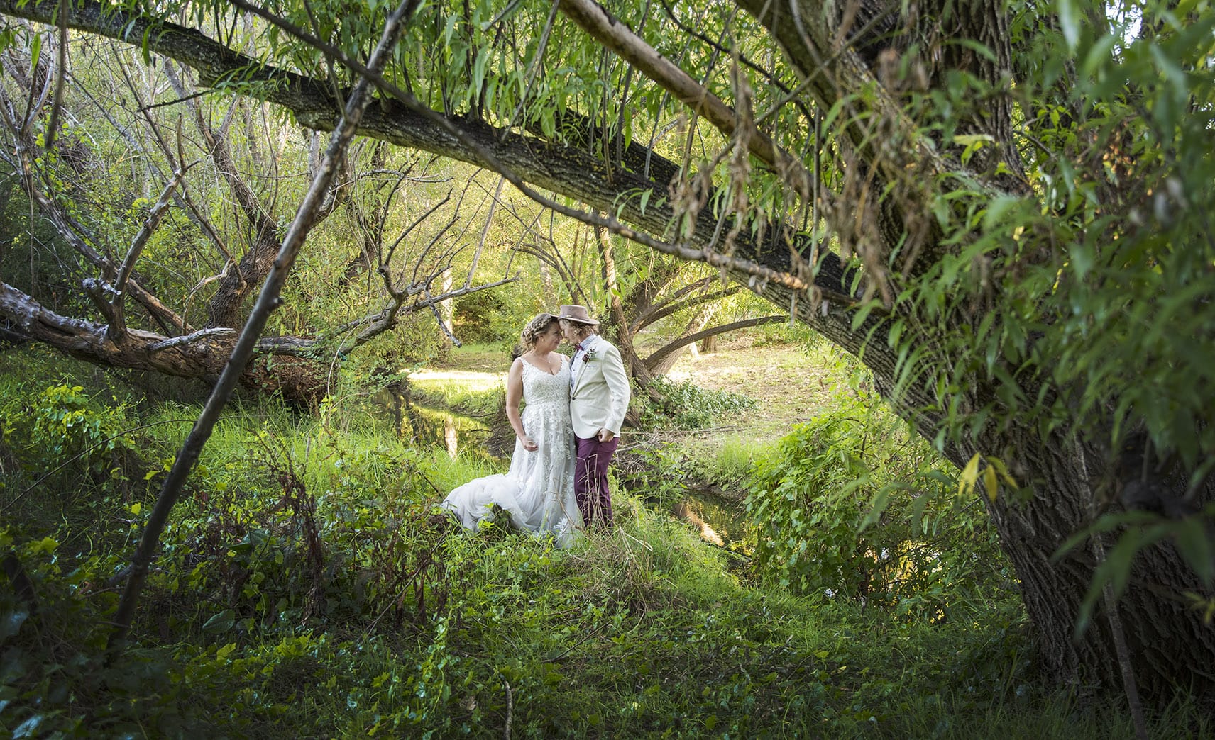 old oval estate wedding - suzie & jay 109 bride and groom under the gree foliage