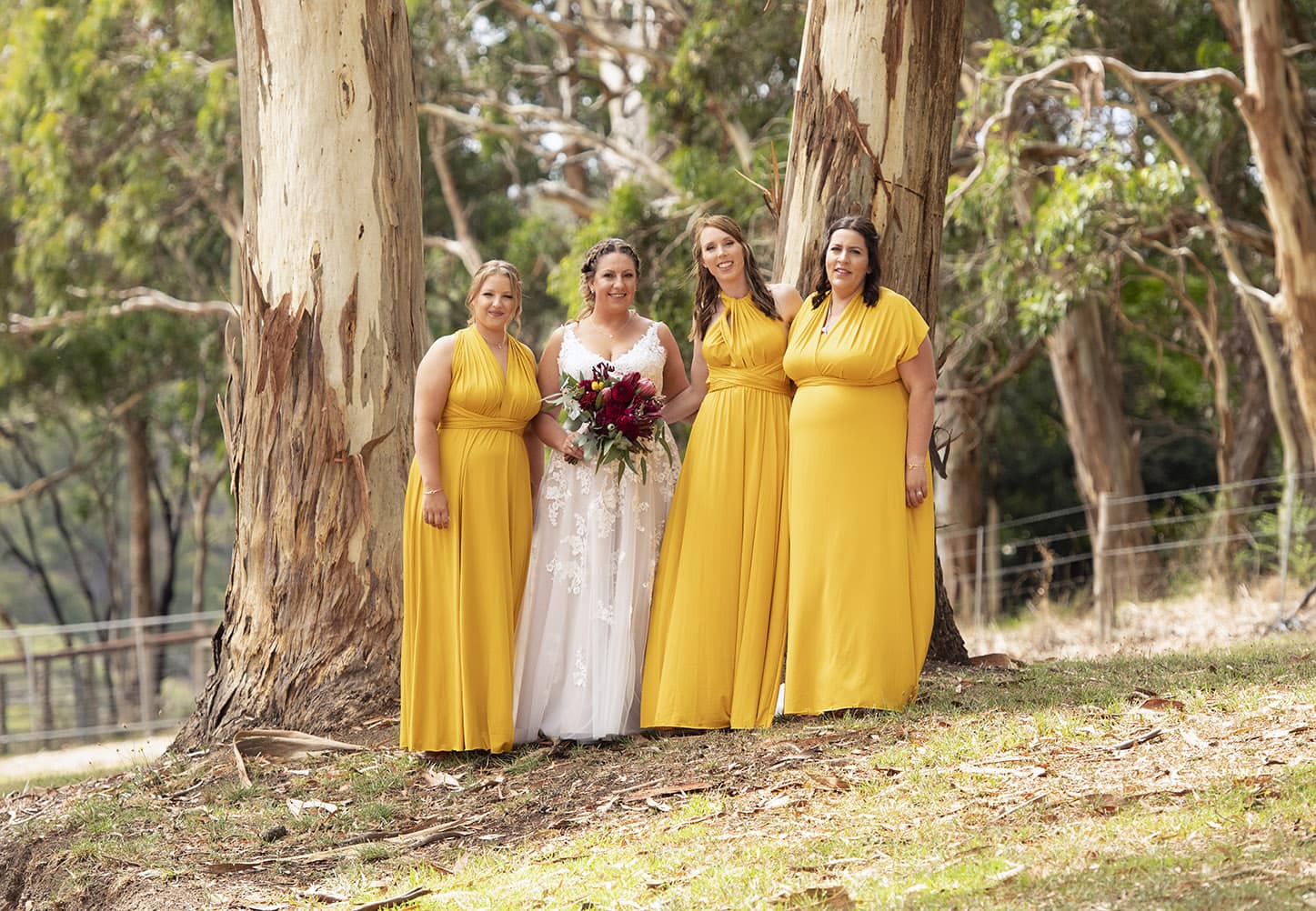 old oval estate wedding - suzie & jay 76 bridesmaids all standing together in front of gum trees