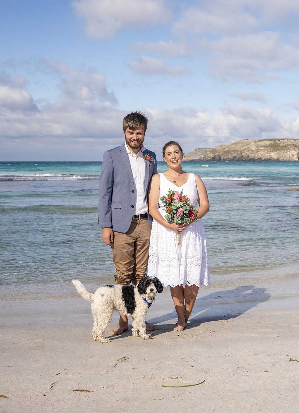 kangaroo island elopement - claire & jacob 34 Claire and Jacob standing barefoot with their dog on Pennington Bay beach after their elopement ceremony