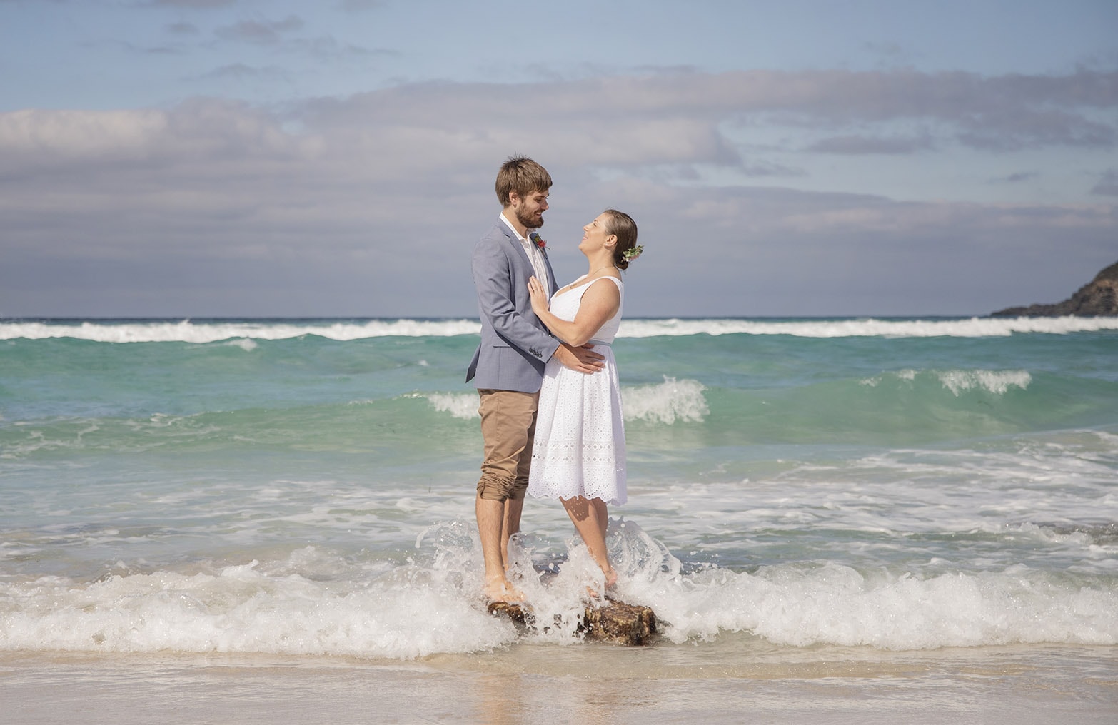 kangaroo island elopement - claire & jacob 41 Claire and Jacob standing on a rock in the surf during their Kangaroo Island elopement photoshoot