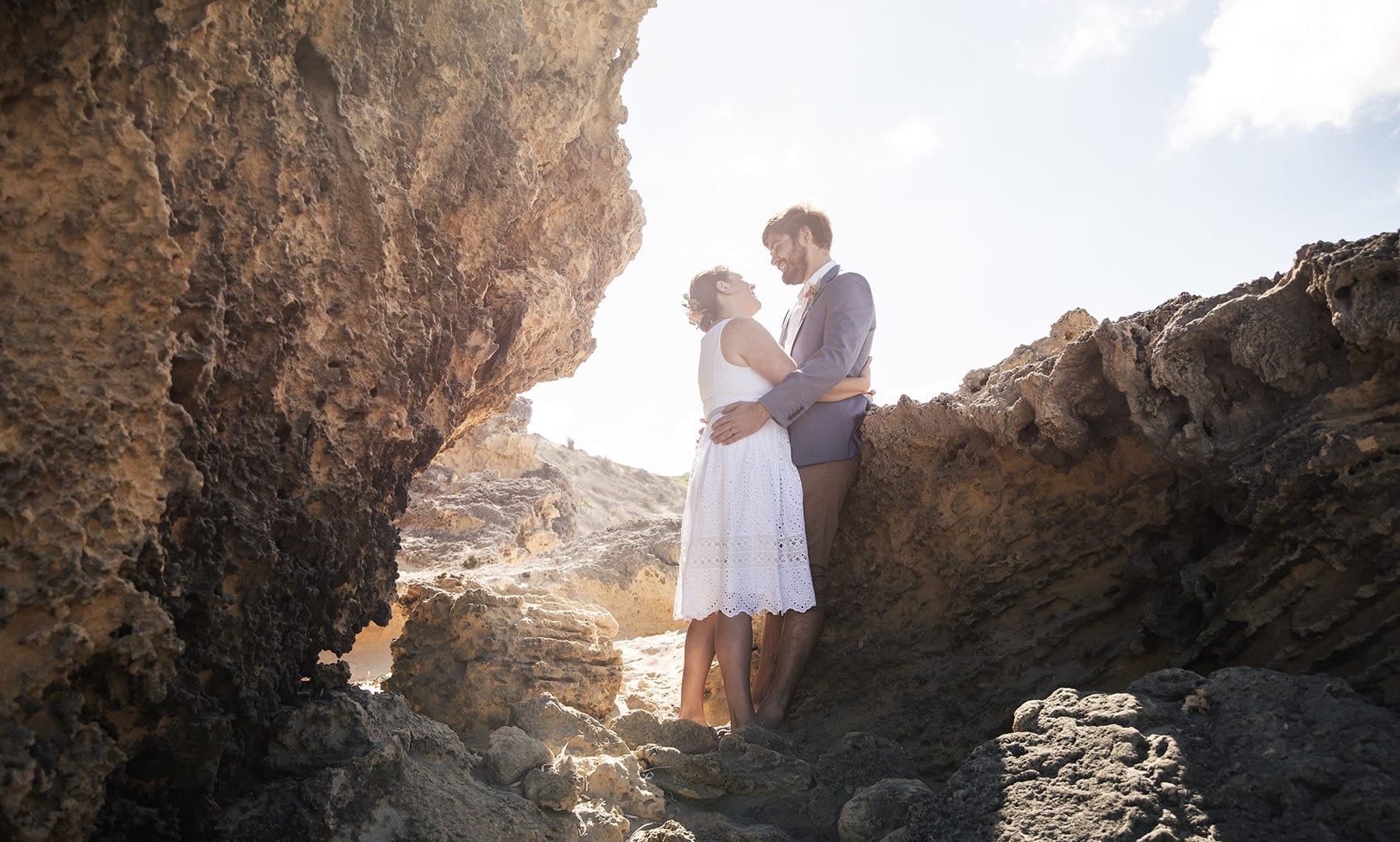 kangaroo island elopement - claire & jacob 40 Claire and Jacob embracing among sunlit coastal rock formations at Pennington Bay