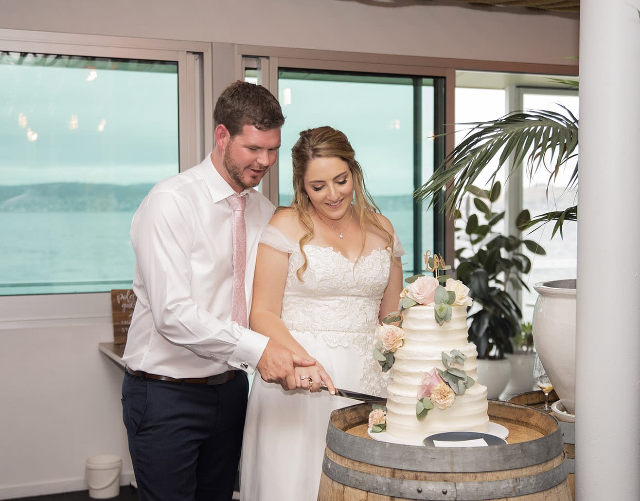 seagrass long point wedding - hobart - georgia & matt 76 Cutting the cake at Seagrass wedding reception