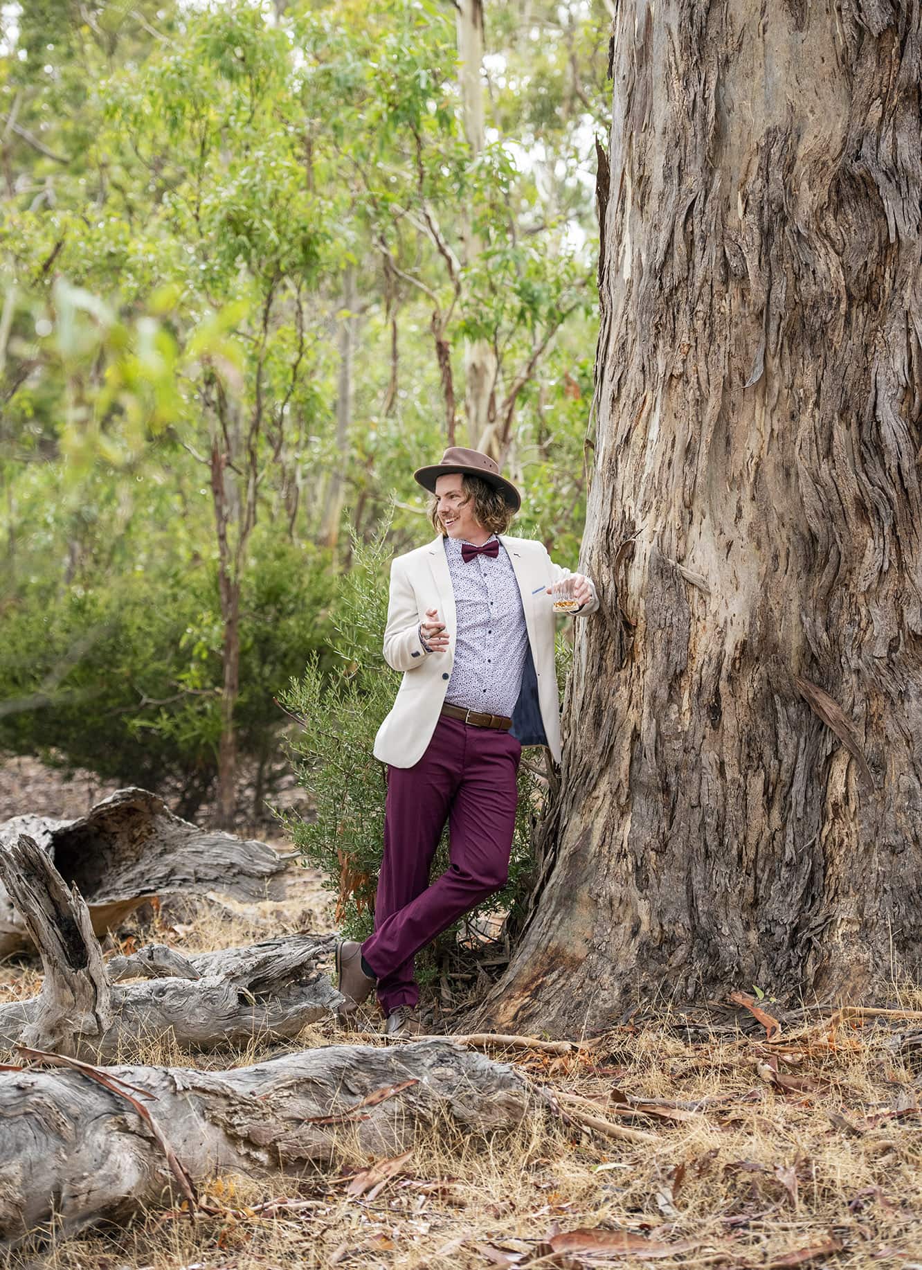 old oval estate wedding - suzie & jay 64 Groom leanng against big gum tree