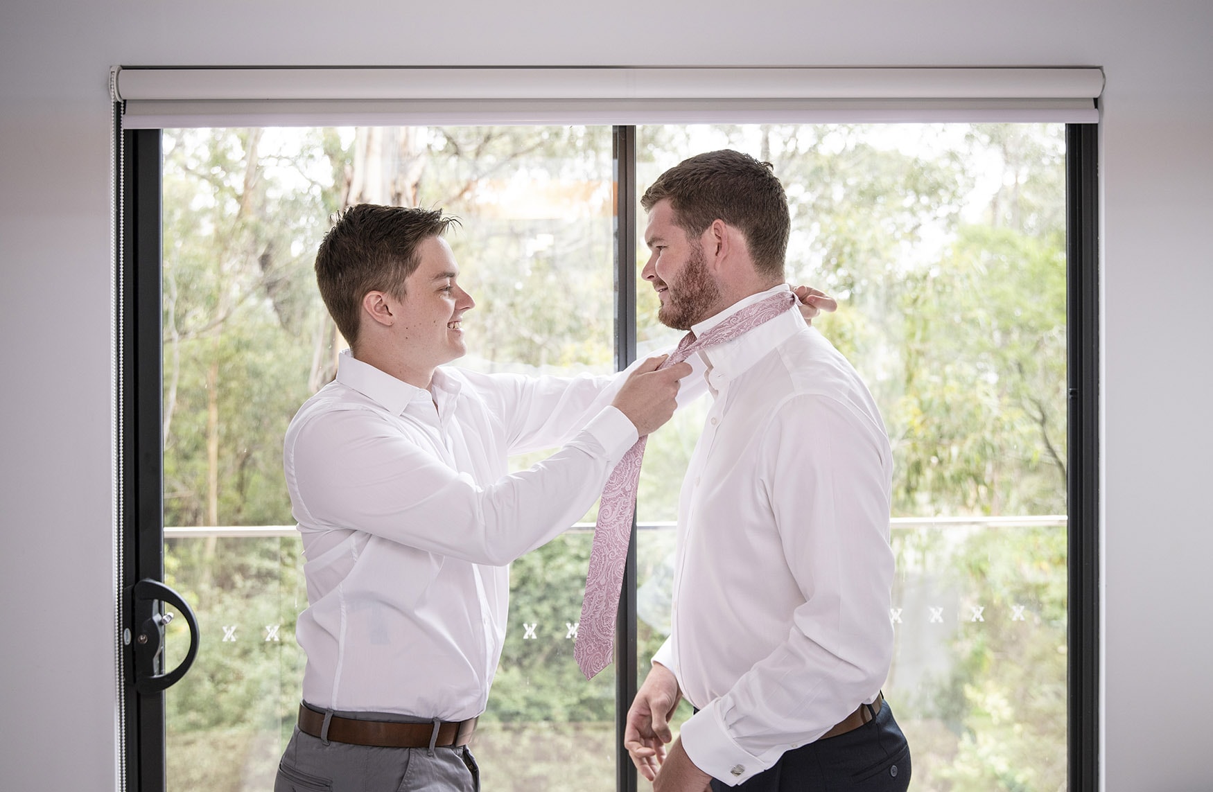 seagrass long point wedding - hobart - georgia & matt 33 helping groom with tie in bedroom