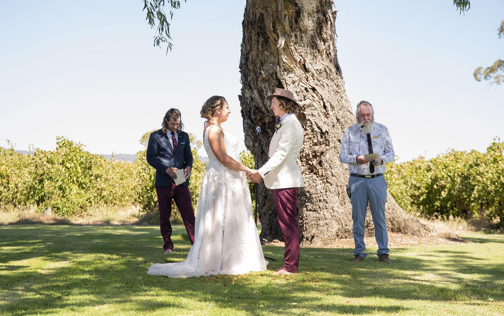 old oval estate wedding - suzie & jay 95 Holding hands at Old Oval Estate Wedding Ceremony