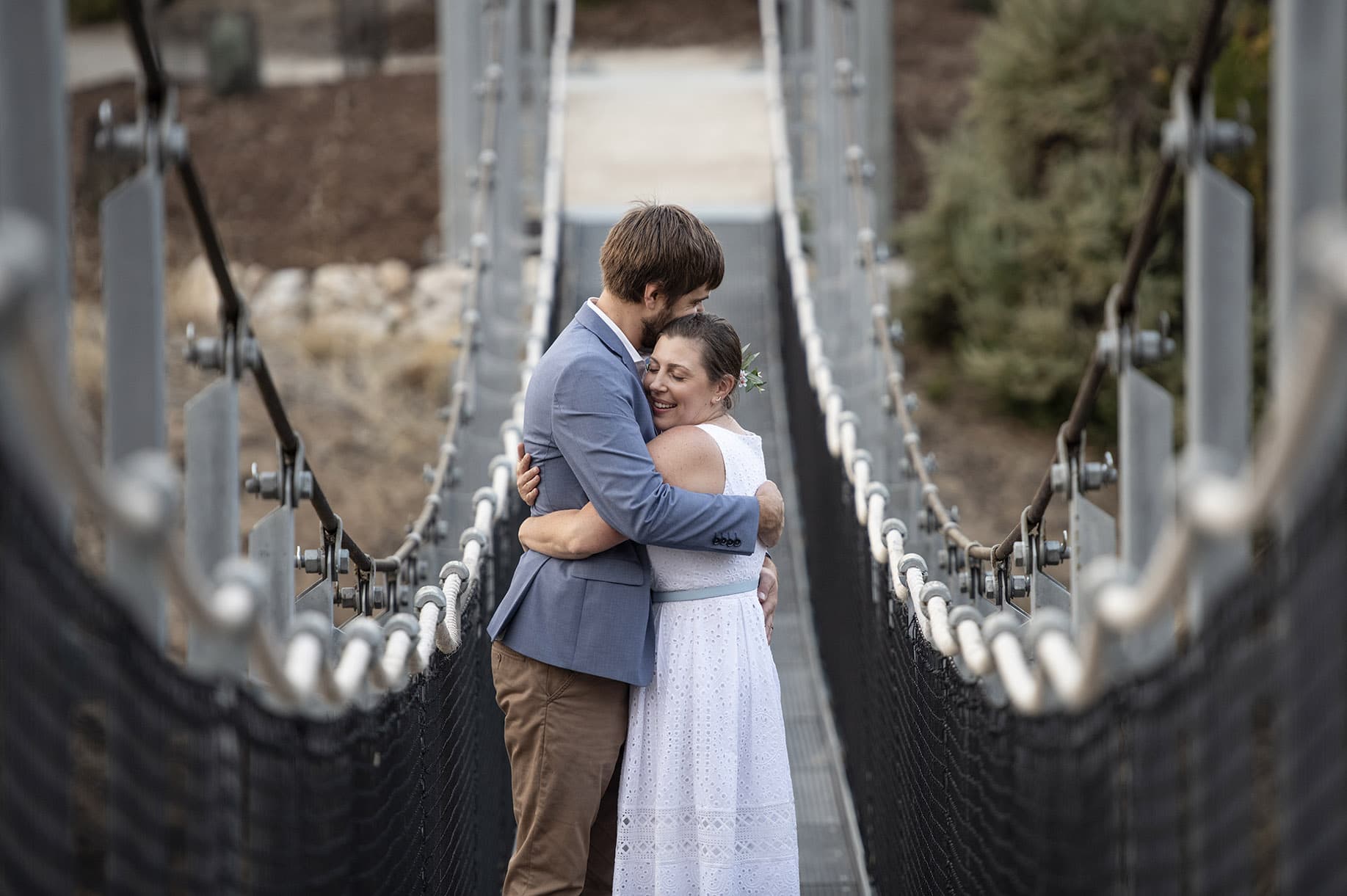 kangaroo island elopement - claire & jacob 9 Claire and Jacob embracing on a suspension bridge during their Kangaroo Island elopement