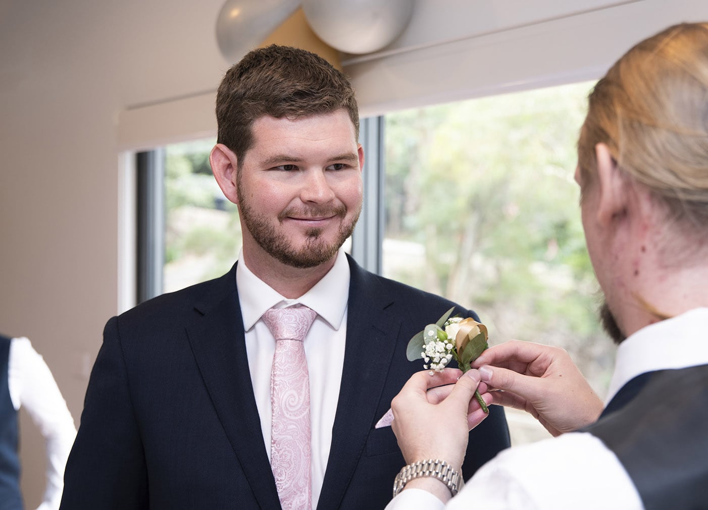 seagrass long point wedding - hobart - georgia & matt 35 Putting on grooms flower