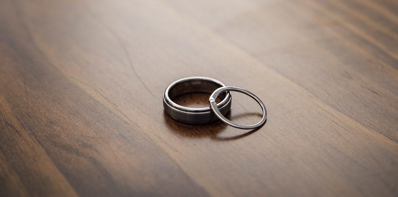 seagrass long point wedding - hobart - georgia & matt 31 wedding rings on table top
