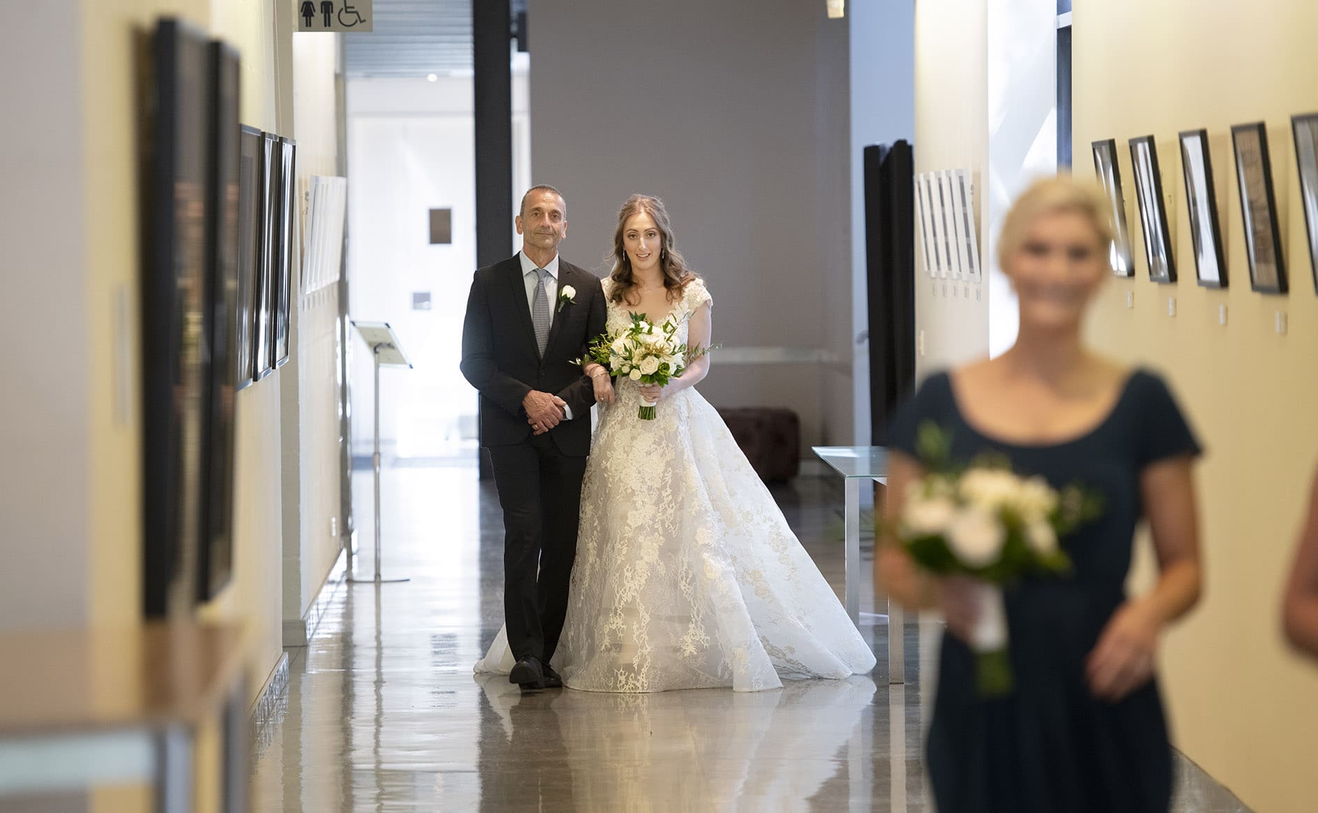 national wine center wedding - pat & kat 139 Bride and father walking towards ceremony