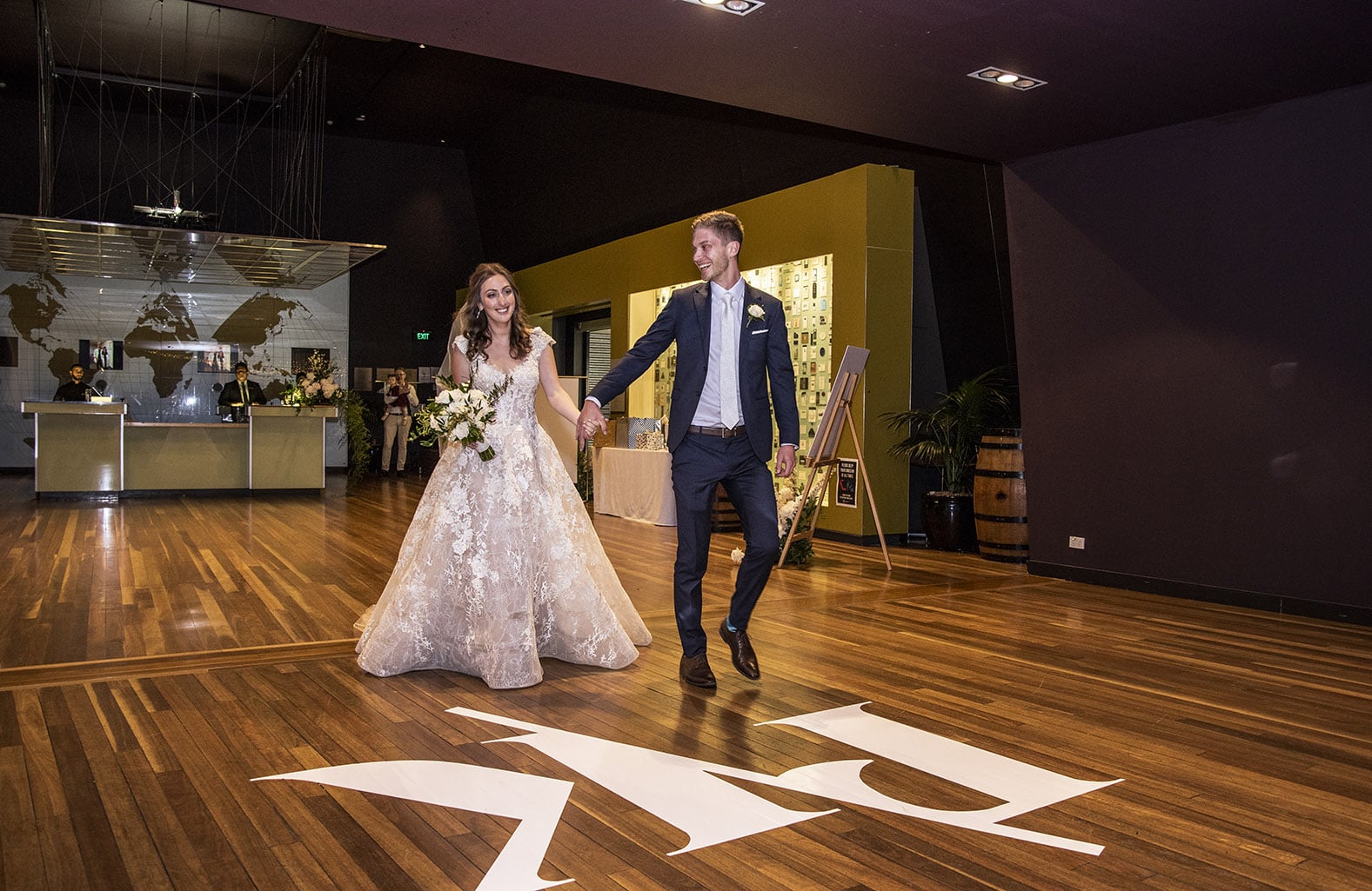 national wine center wedding - pat & kat 175 bride and groom entering National Wine Center wedding reception
