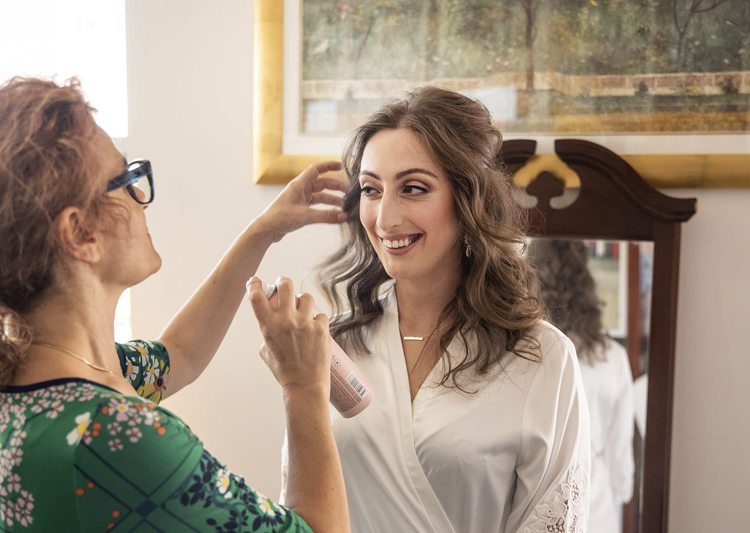national wine center wedding - pat & kat 127 bride having her makeup done smiling