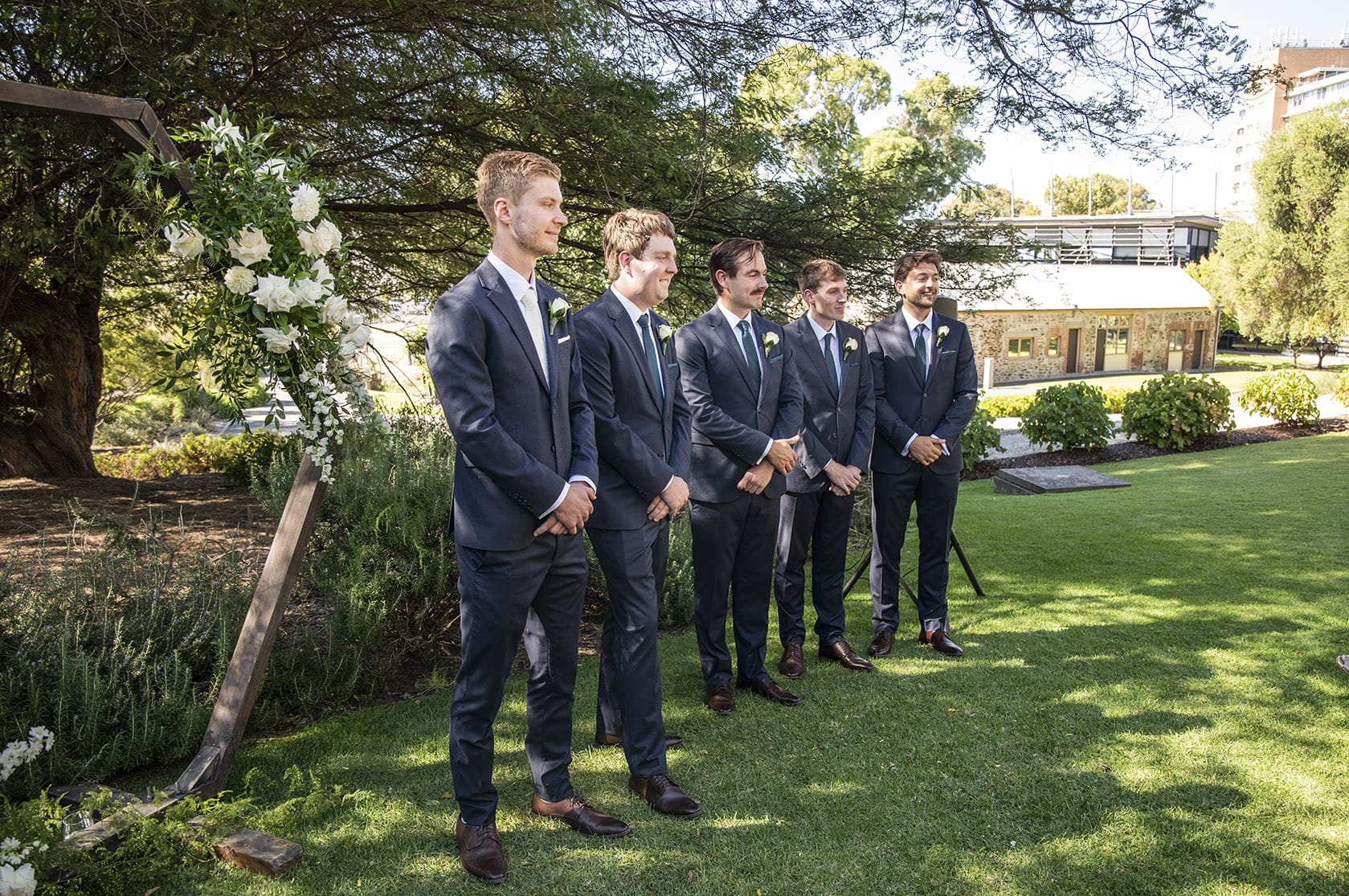national wine center wedding - pat & kat 138 groom and groomsmen lined up at front of ceremony