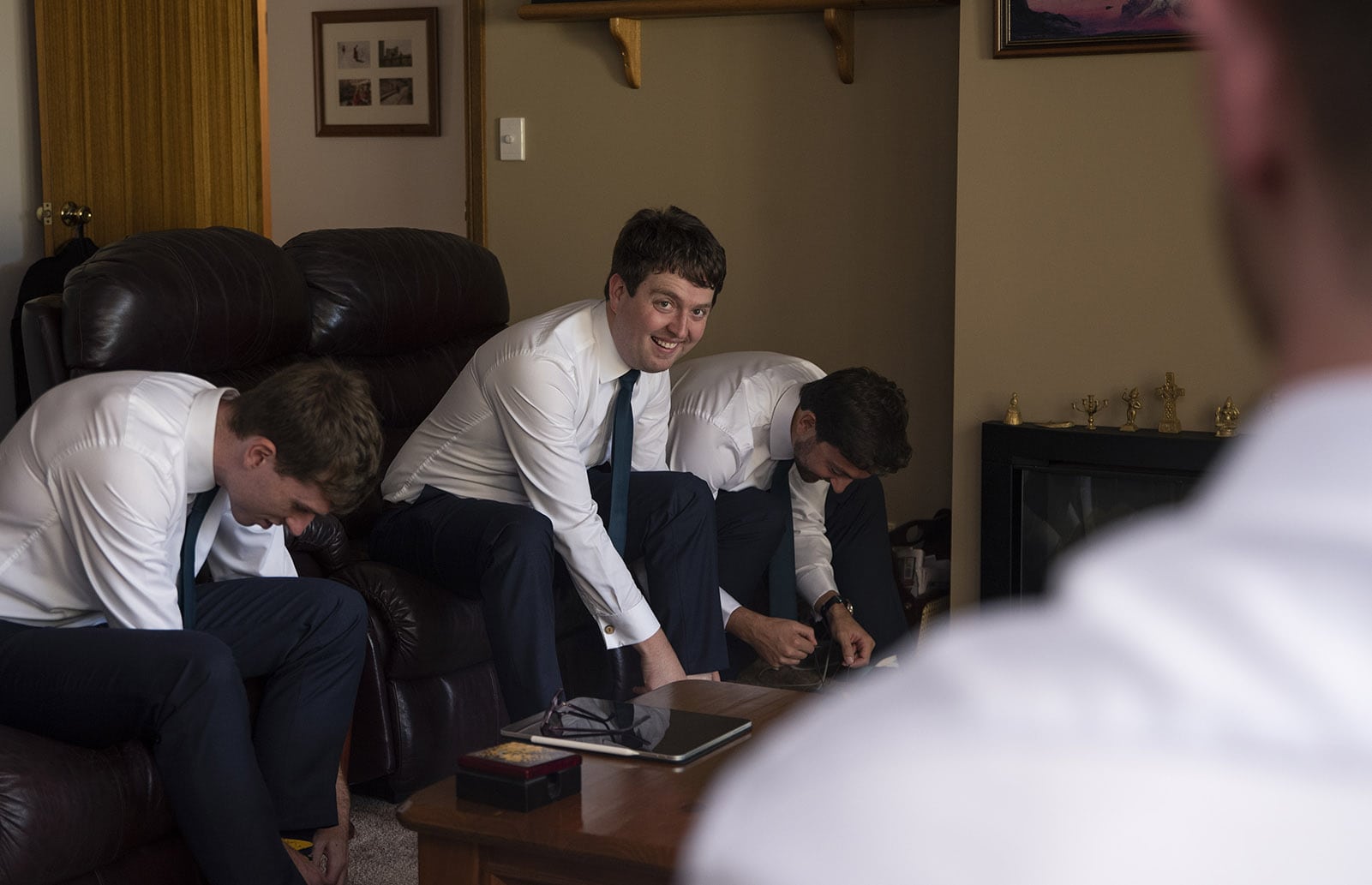 national wine center wedding - pat & kat 112 Groomsmen getting ready on couch