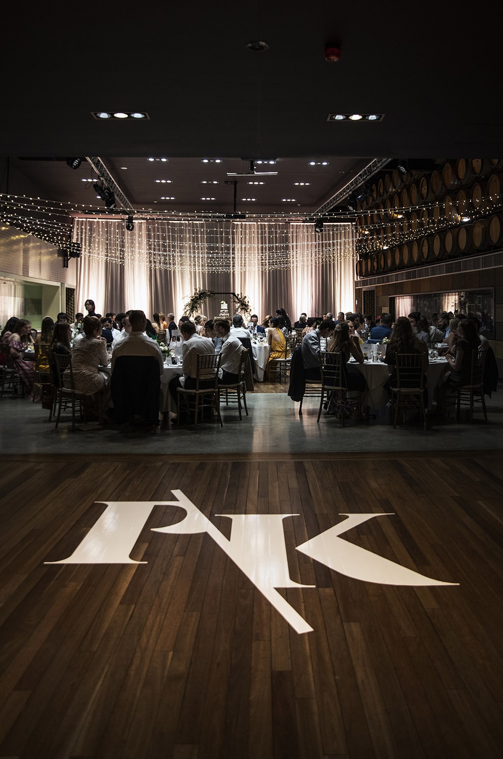 national wine center wedding - pat & kat 173 PK decal on dancefloor