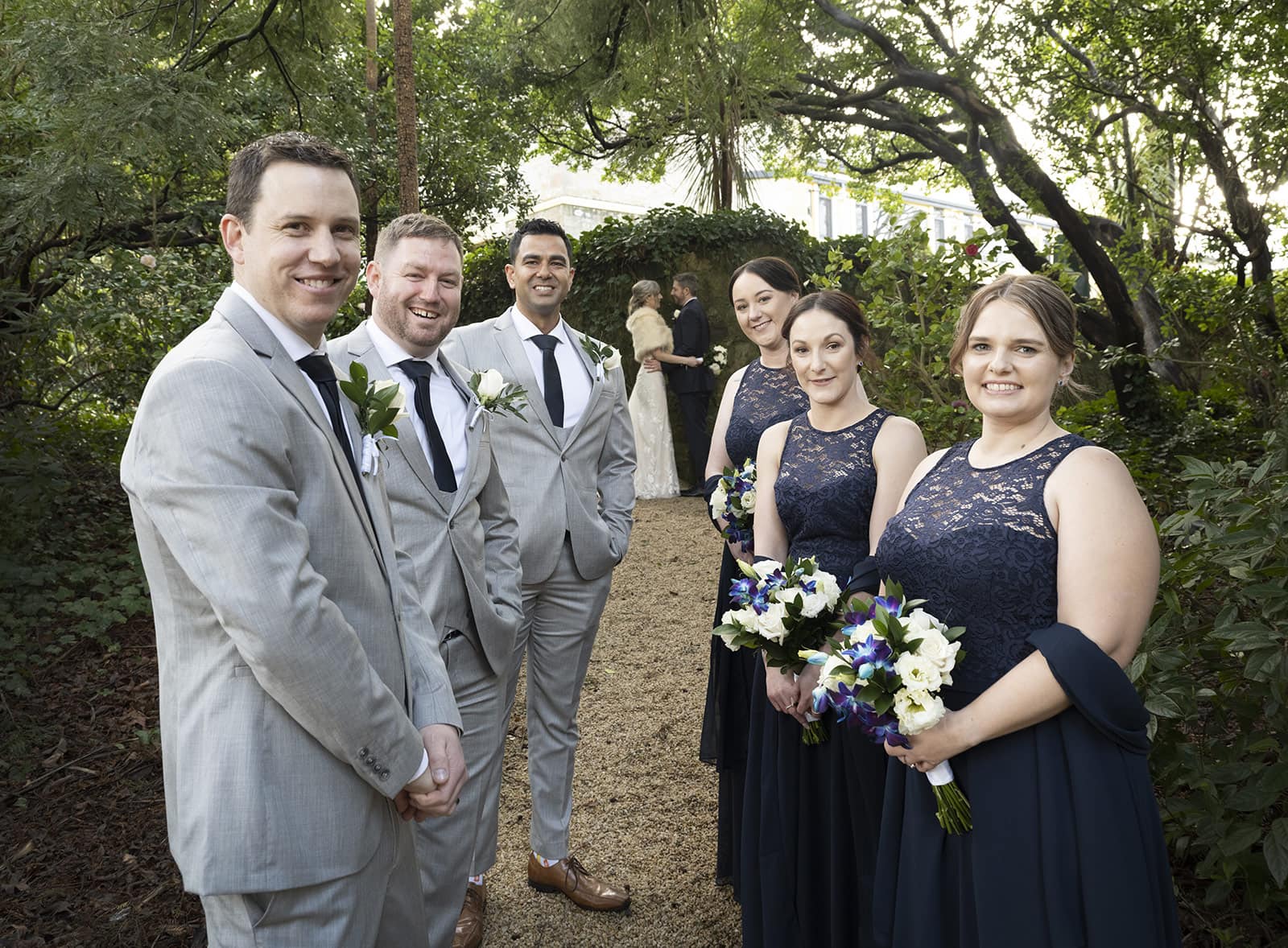 mount lofty house wedding - katrina & lucas 49 Bridal party with the bride and groom in the background