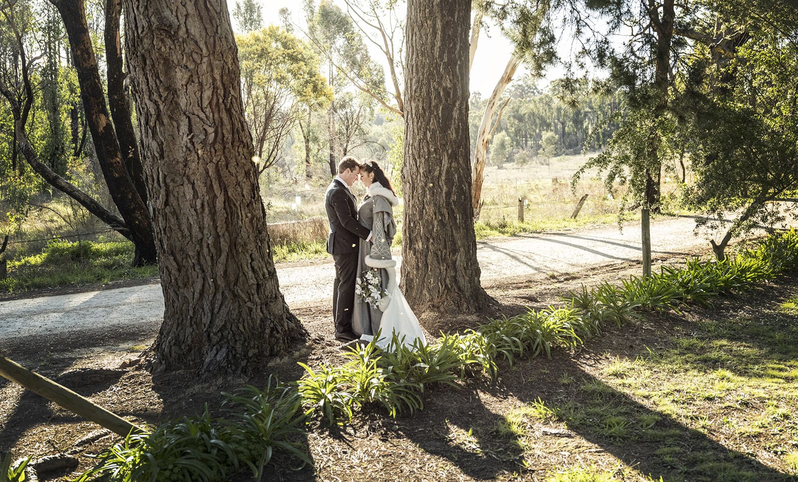 mount torrens hotel wedding - clare & craig 60 bride ad groom in between two large trees